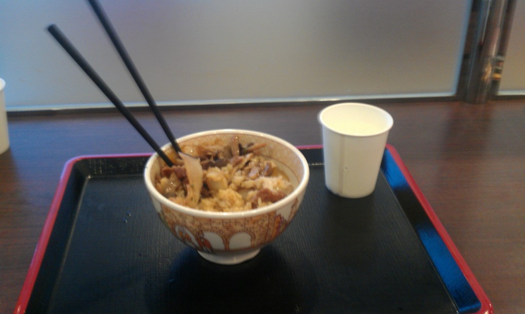 Some chicken, rice, and mushrooms from a "Sukiya" chain restaurant.